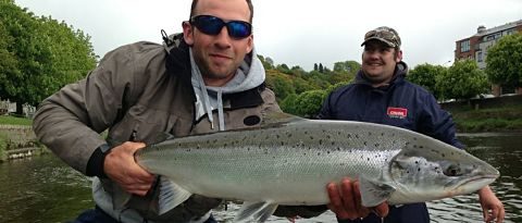 fisher man with large salmon