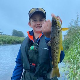 Boy with Brown trout on Slaney